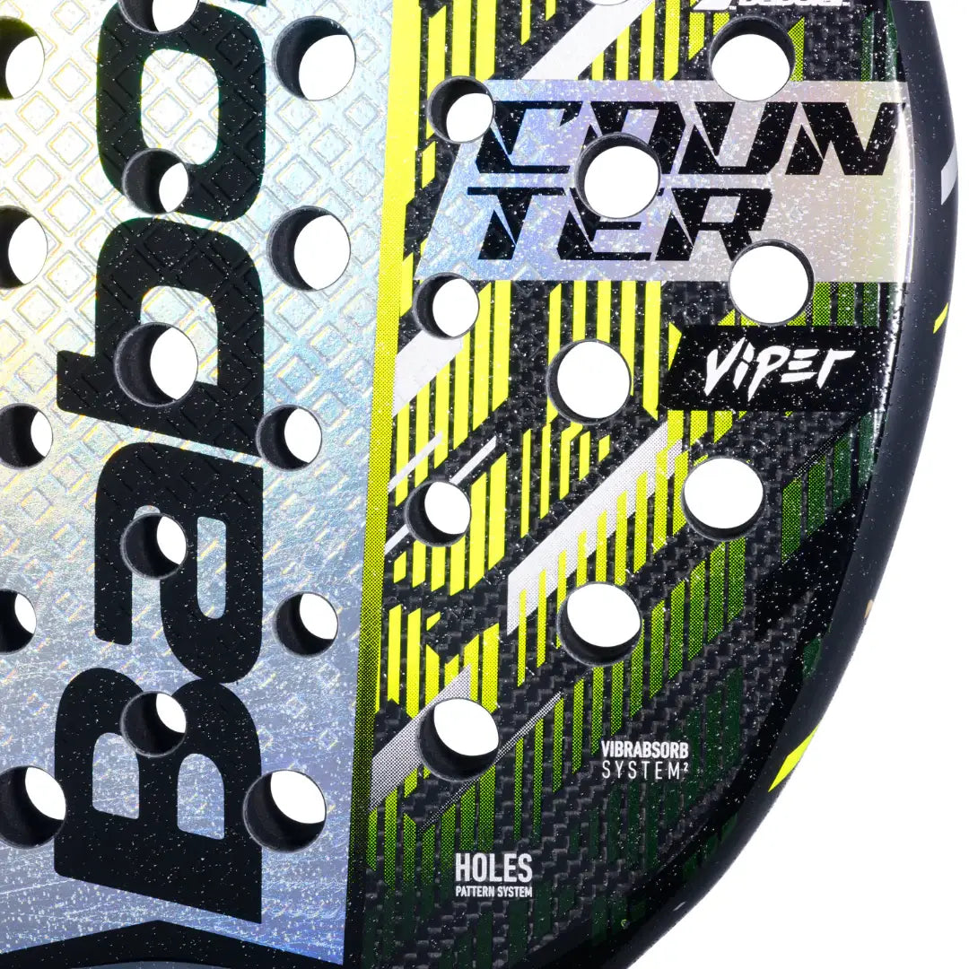 Close-up of a Babolat tennis racket with branding and design details.
