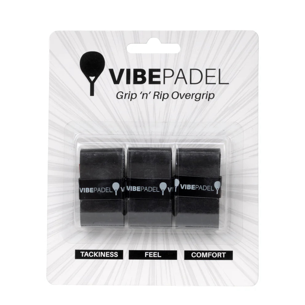 Three black Vibe padel racket overgrips, packaged in a clear plastic blister pack labeled with 'VIBEPADEL' and attributes like 'TACKINESS', 'FEEL', and 'COMFORT'.