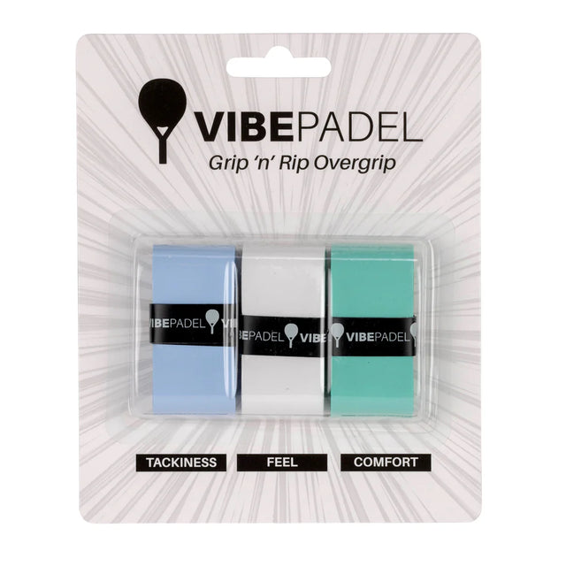 Three Vibe padel racket overgrips in blue, white, and green colors, packaged in a clear plastic blister pack labeled with 'VIBEPADEL' and attributes like 'TACKINESS', 'FEEL', and 'COMFORT'.