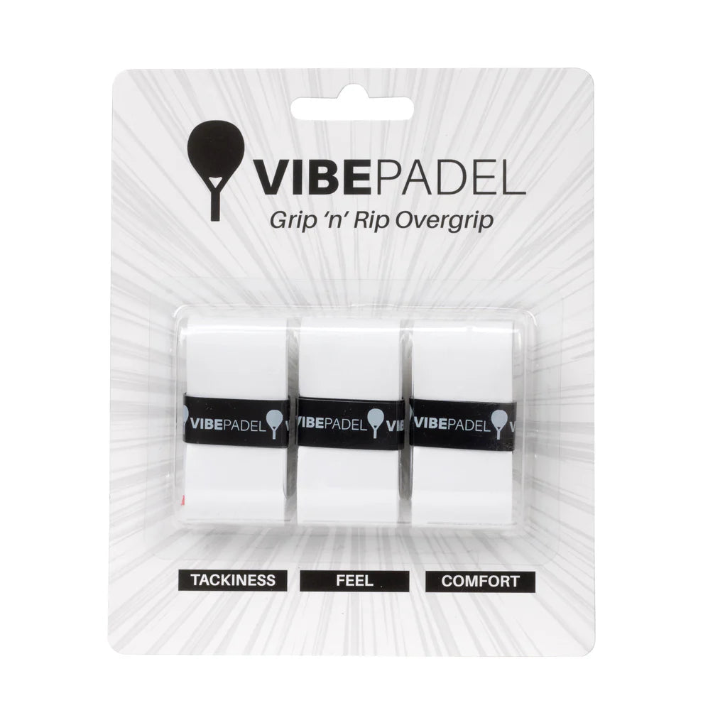 Three Vibe padel racket overgrips in white, packaged in a clear plastic blister pack labeled with 'VIBEPADEL' and attributes like 'TACKINESS', 'FEEL', and 'COMFORT'.