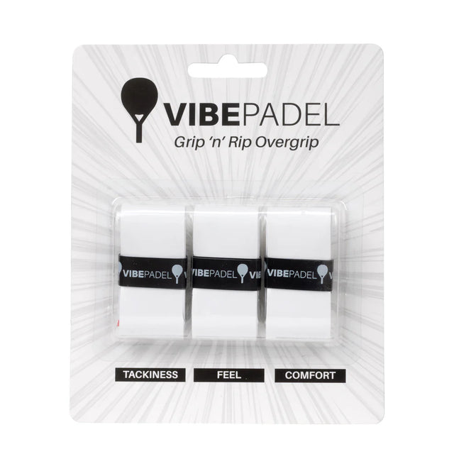 Three Vibe padel racket overgrips in white, packaged in a clear plastic blister pack labeled with 'VIBEPADEL' and attributes like 'TACKINESS', 'FEEL', and 'COMFORT'.