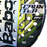 Close-up of a Babolat tennis racket with branding and design details.